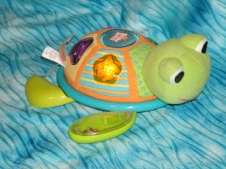Bright Starts Lights Music and Melodies Push Along Turtle with Rattle Feet
