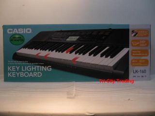 Casio LK 160 Key Lighting Keyboard w Adapter and Stand